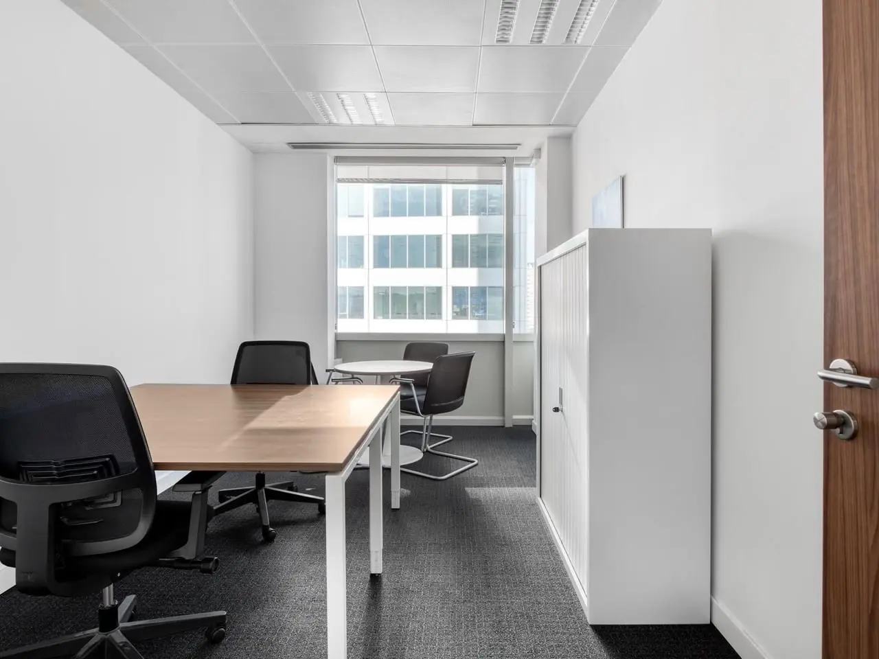 private office with chairs and meeting table